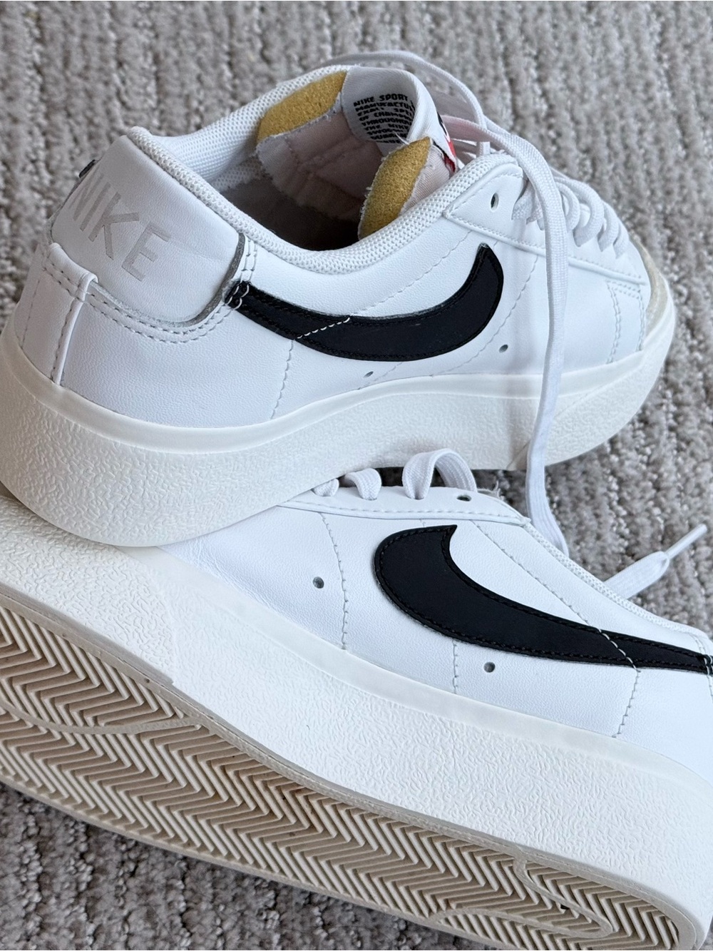 Nike White Platform Sneakers with Black Swoosh